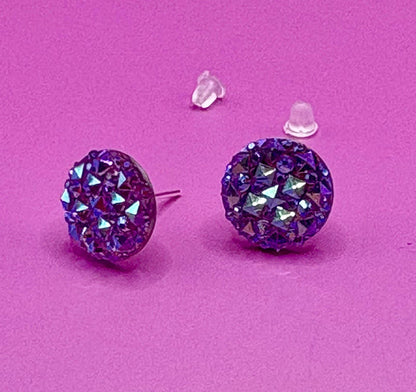 Dazzling purple stud earrings with sparkling gemstones, perfect for adding a touch of elegance to any outfit and enhancing your jewelry collection.
