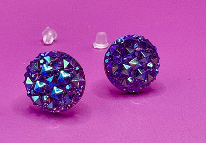 Dazzling purple stud earrings with sparkling gemstones, perfect for adding a touch of elegance to any outfit and enhancing your jewelry collection.