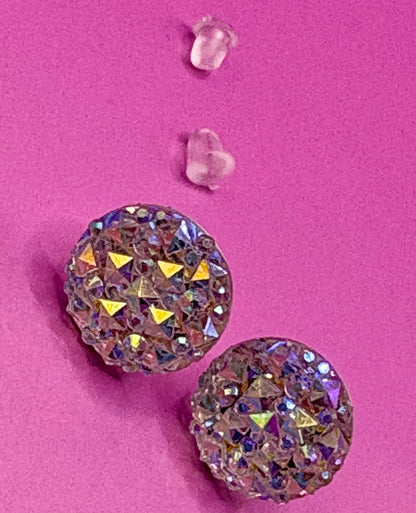 Dazzling silver stud earrings with sparkling gemstones, perfect for adding a touch of elegance and shine to any outfit for both casual and formal occasions.