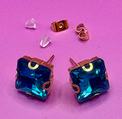 Stunning elegant blue gemstone earrings set in gold, designed for a luxurious look, perfect for special occasions, weddings, or adding sophistication to everyday outfits.