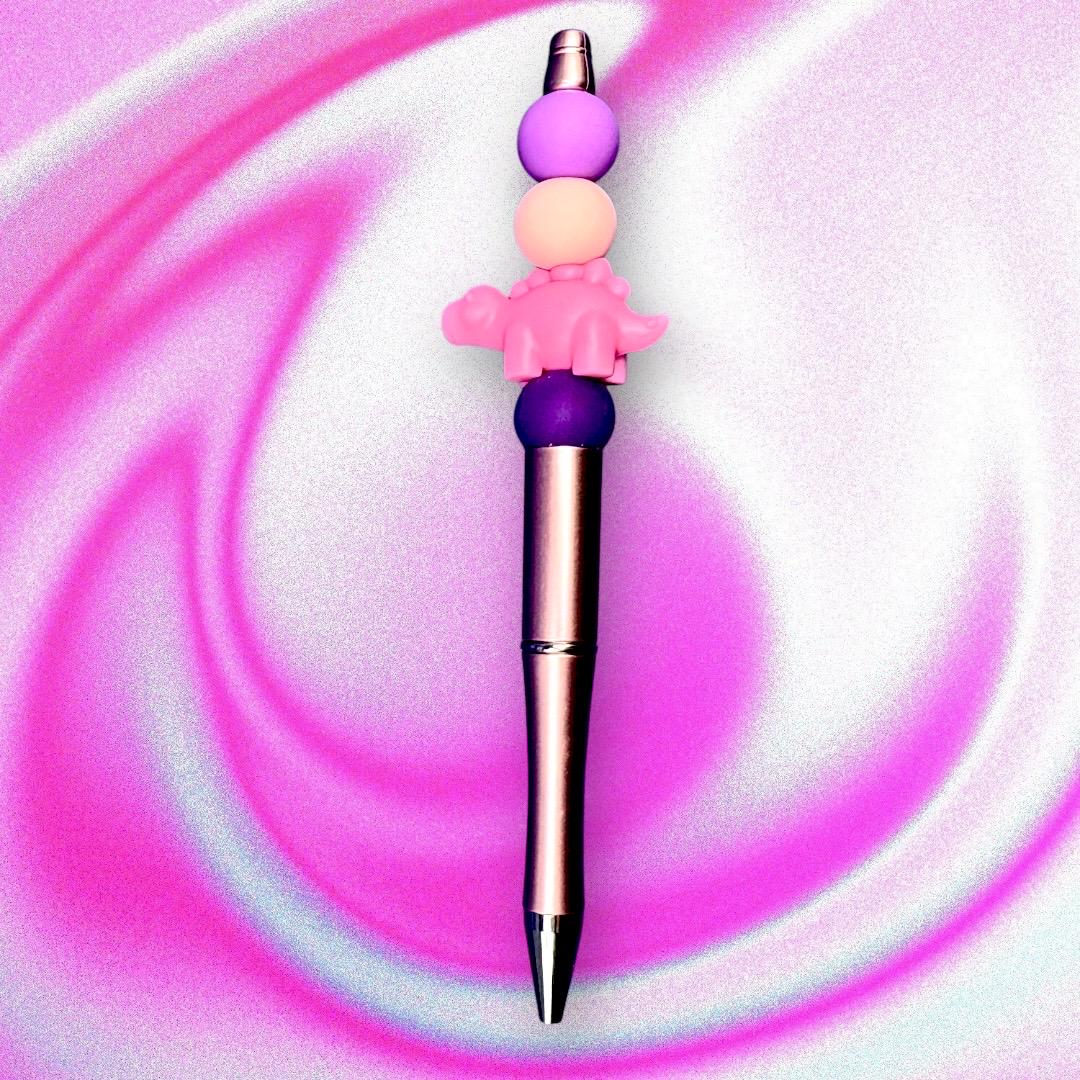 pink dinosaur pen Elevate your writing experience with our delightful Dinosaur-Themed Black Ballpoint Pens! Each pen features a whimsical design, complete with colorful beads including camouflage and adorable pink or grey dinosaur toppers, making them the perfect addition to your stationery collection or a standout gift for anyone who loves fun and functionality.
