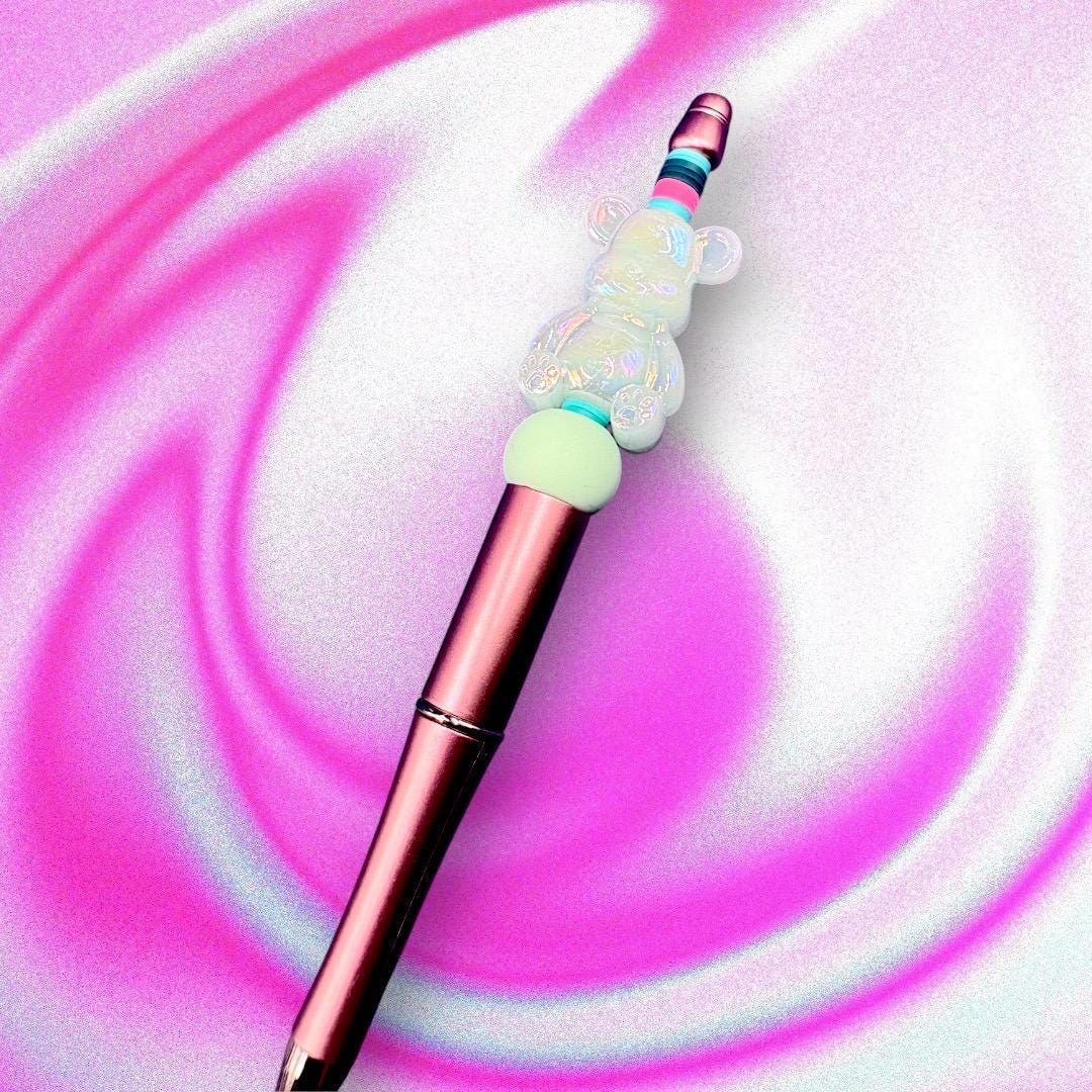 Unleash your creativity with our Charming Gummy Bear-Themed Black Ballpoint Pen! This whimsical writing tool features an adorable gummy bear topper along with vibrant beads, combining functionality with fun in one delightful package