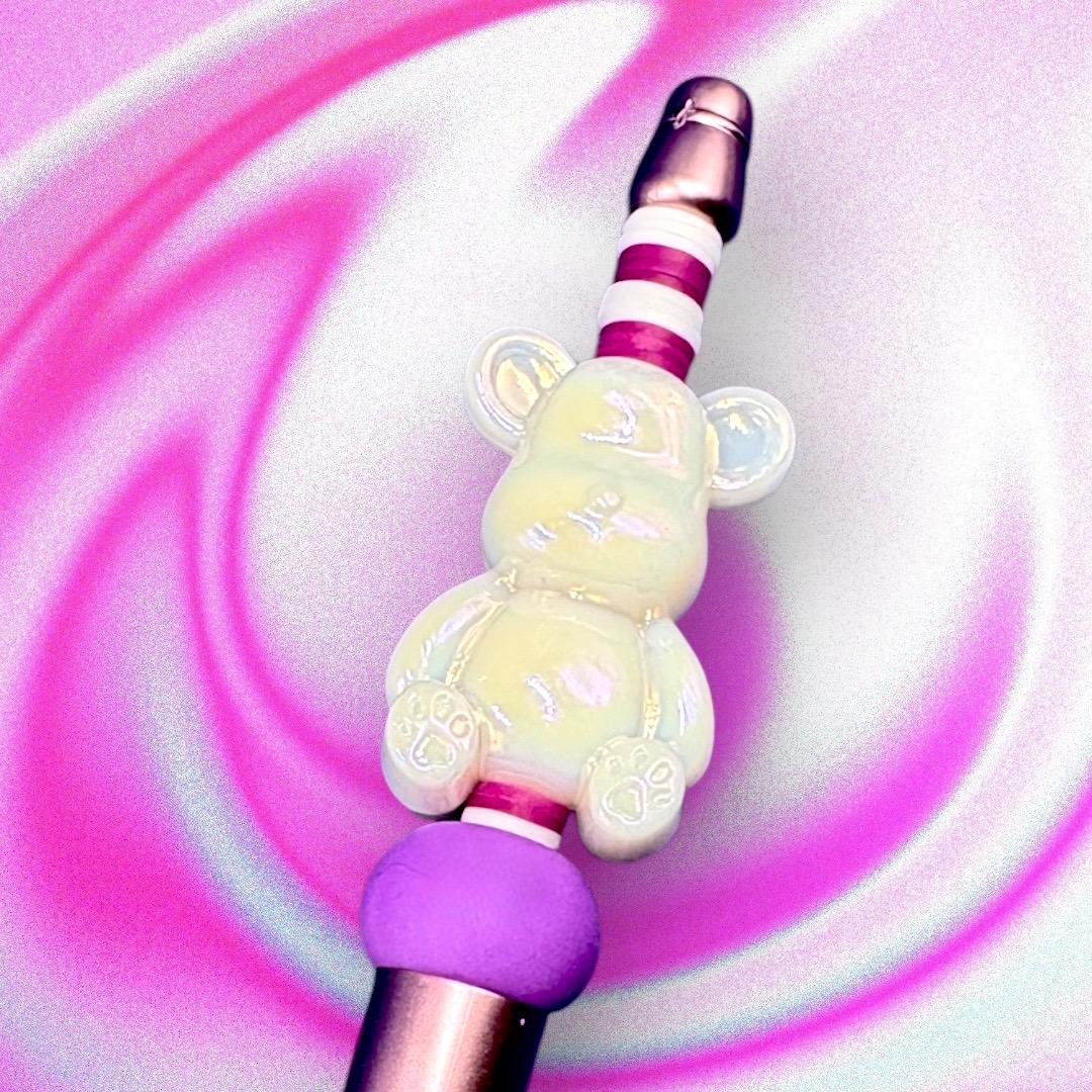 pink dinosaur penUnleash your creativity with our Charming Gummy Bear-Themed Black Ballpoint Pen! This whimsical writing tool features an adorable gummy bear topper along with vibrant beads, combining functionality with fun in one delightful package