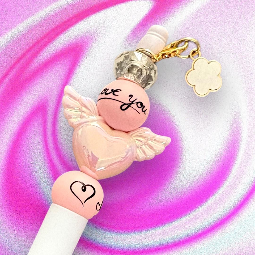 Handcrafted Colourful Black Ballpoint Pens | Unique Beaded Writing Pens | Cute Stationery Gifts for Students & Writers angel wings love
Elevate your writing experience with our enchanting black ballpoint pens, each uniquely designed with delightful heart charms, angel wings and colorful leopard print beads with a cute clover charm!