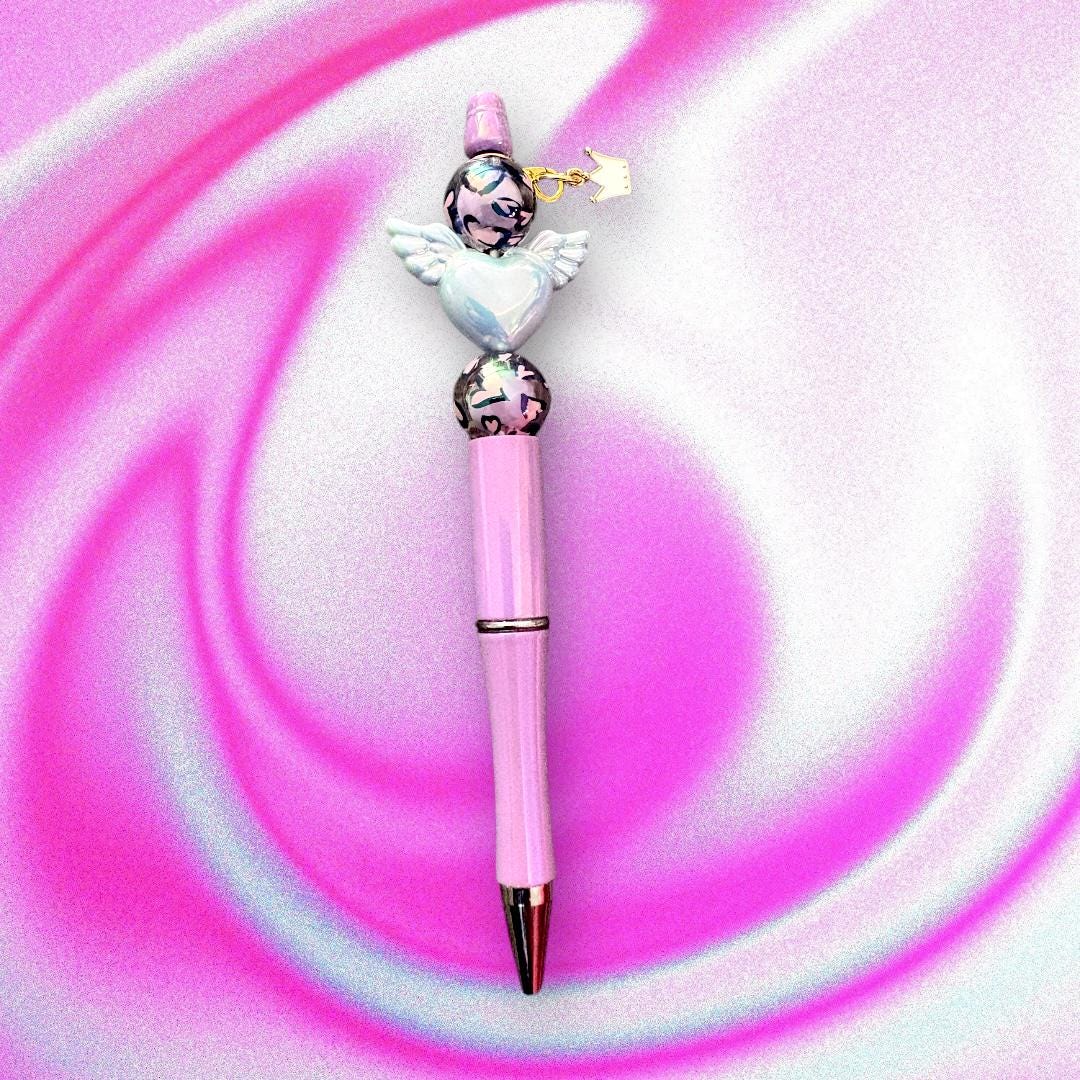 Handcrafted Colourful Black Ballpoint Pens | Unique Beaded Writing Pens | Cute Stationery Gifts for Students & Writers angel wings love
Elevate your writing experience with our enchanting black ballpoint pens, each uniquely designed with delightful heart charms, angel wings and colorful leopard print beads with a cute clover charm!