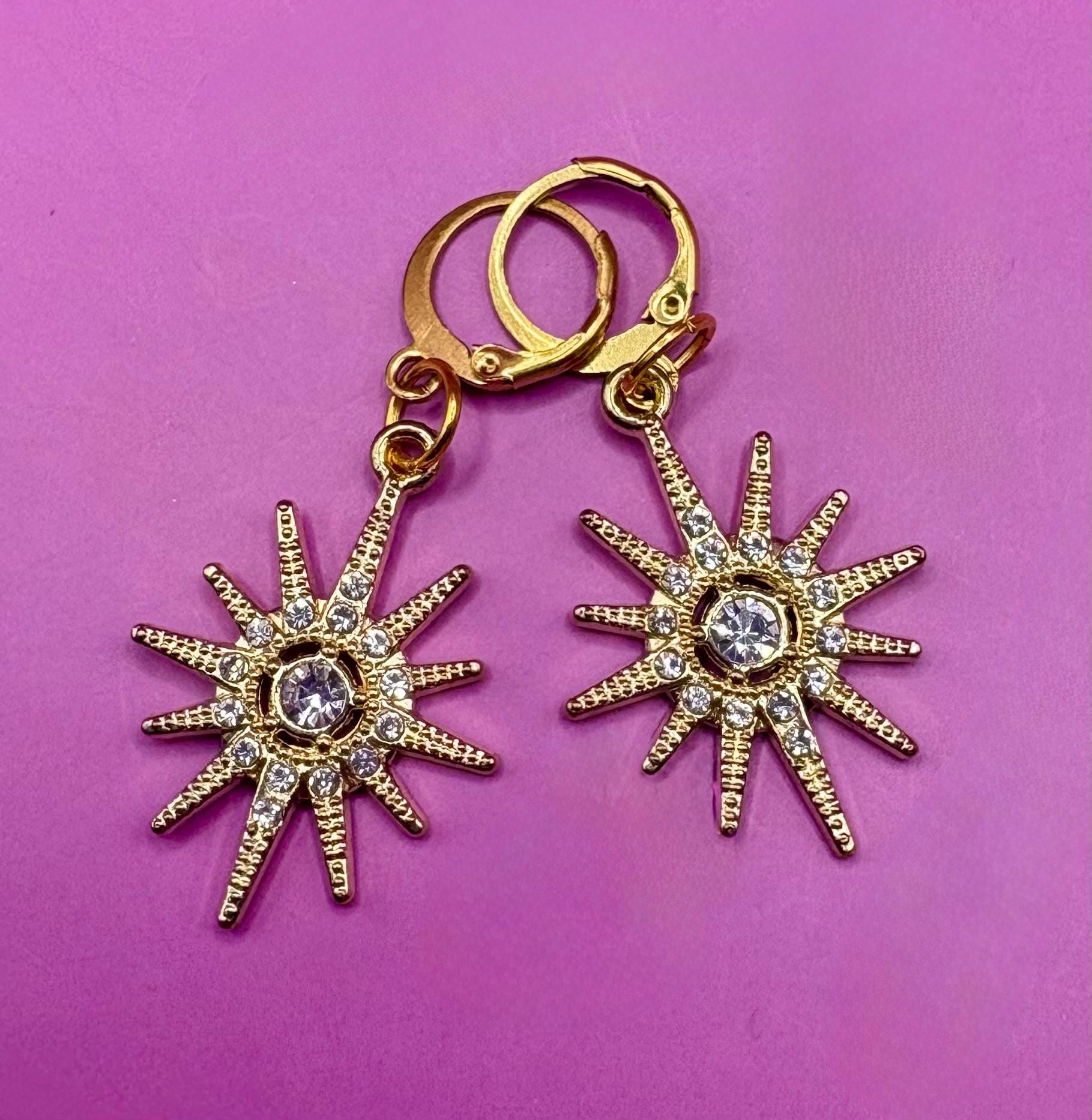 Stunning bright star earrings- colour gold