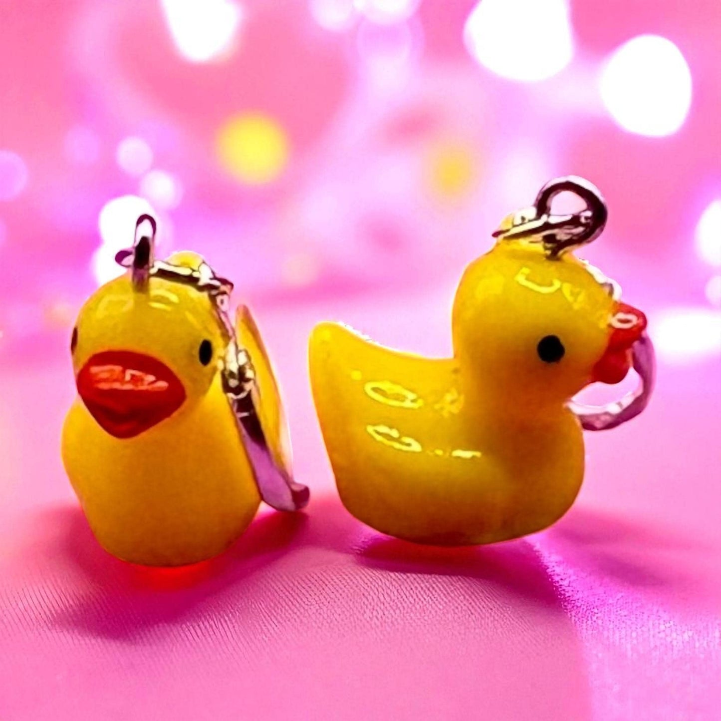 Cute little rubber duck style earrings, dangly drop earrings. available in multiple colours. pink blue yellow purple white costume jewellery