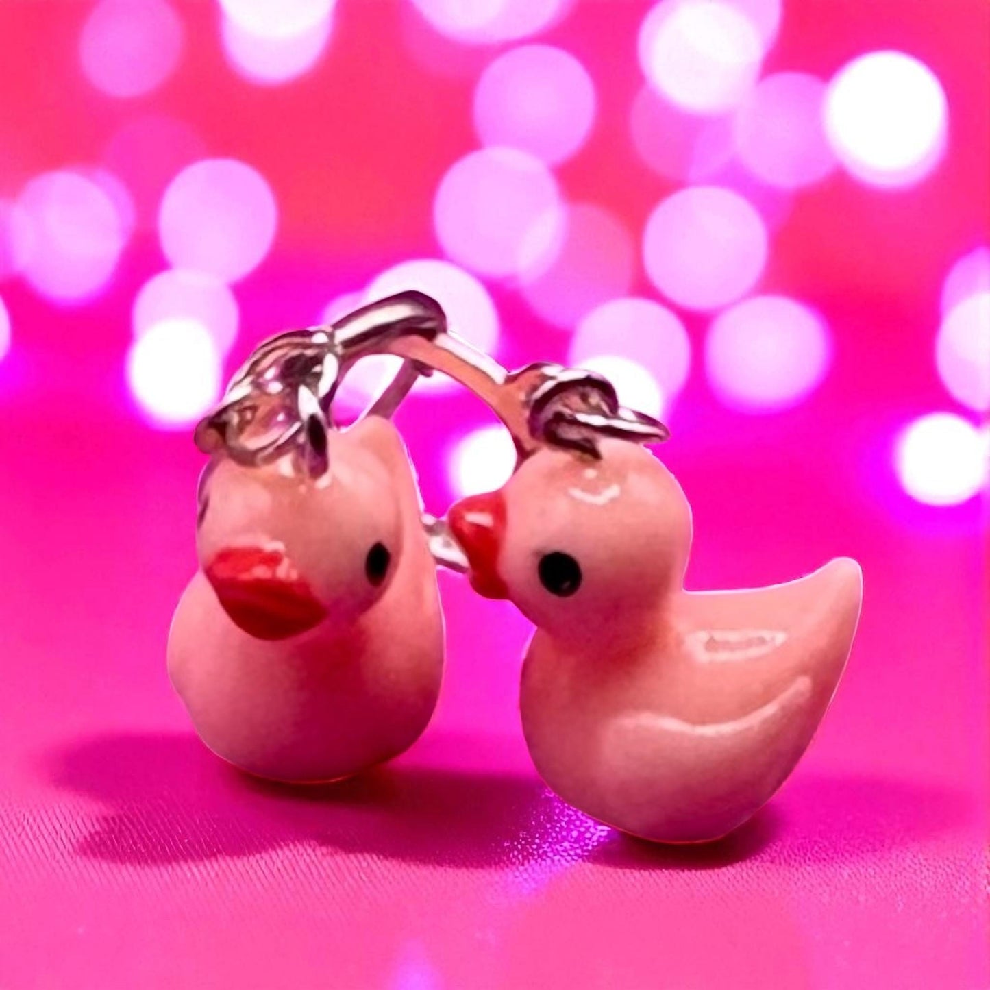 Cute little rubber duck style earrings, dangly drop earrings. available in multiple colours. pink blue yellow purple white costume jewellery