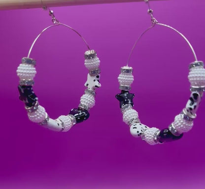 Elegant handmade beaded hoop earrings in black, featuring intricate design and a stylish finish, perfect for enhancing any outfit and suitable for both casual and formal occasions.